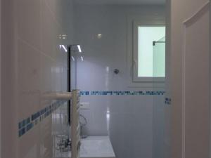 a white bathroom with a sink and a mirror at Gîte familial en Auvergne avec jardin, ping-pong, proche stations thermales, animaux acceptés - FR-1-489-127 in Mazirat +17 photos