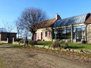 an old stone house with a road in front of it at Fermette rénovée avec charme Bourbonnais, jardin arboré, clim, Wifi, animaux acceptés, proche Commentry - FR-1-489-228 in Beaune dʼAllier