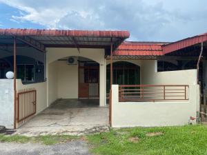 a small house with a red roof at Staycation Taiping Homestay in Taiping