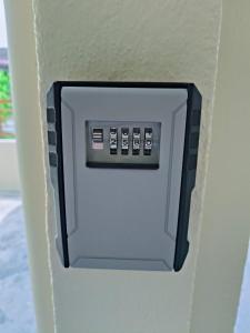 a lightswitch on a wall with at Staycation Taiping Homestay in Taiping