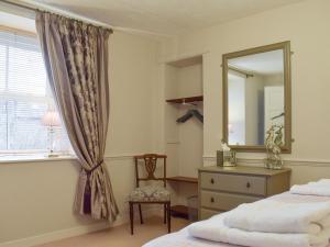 Postel nebo postele na pokoji v ubytování Smiddy Cottage