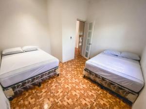 Giường trong phòng chung tại Planton House
