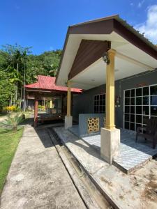 a pavilion with a roof on a house at BESTUBA COTTAGE at PULAU TUBA, LANGKAWI in Pulau Selang Besar +13 photos