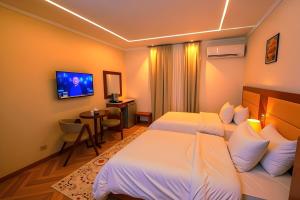 Letto o letti in una camera di THree PYramiDs & SPhinX HoTeL