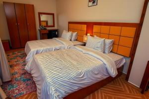 Letto o letti in una camera di THree PYramiDs & SPhinX HoTeL