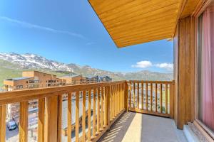 a balcony with a view of the mountains at Modern 3BR Duplex - Val Thorens Centre, Parking & Panoramic Views in Val Thorens