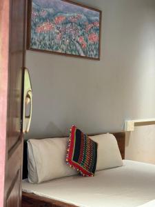 Ein Bett oder Betten in einem Zimmer der Unterkunft Cat Homestay