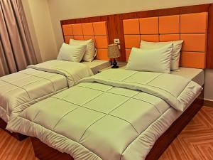 Letto o letti in una camera di THree PYramiDs & SPhinX HoTeL