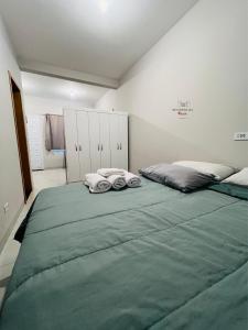 Postel nebo postele na pokoji v ubytování Residencial Yama