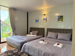 two beds with swans on them in a bedroom at SODANY RESORT Kohrong in Koh Rong +75 photos