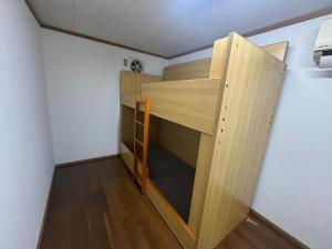 a room with a wooden bunk bed in a room at Shinfuji Auto Campsite - Vacation STAY 53262v in Kami-ide
