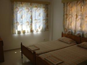Postel nebo postele na pokoji v ubytování Marios Apartments