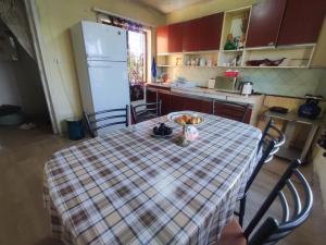 a kitchen with a table with a plate of food on it at Our Village in Ashtarak
