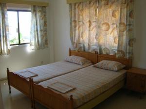 Postel nebo postele na pokoji v ubytování Marios Apartments