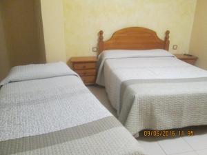 Postel nebo postele na pokoji v ubytování Pensio l'Avi Pep