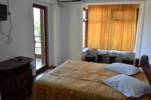 Postel nebo postele na pokoji v ubytování Hotel Corsar + 20 fotografií