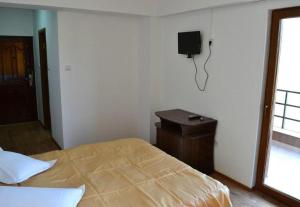 Postel nebo postele na pokoji v ubytování Hotel Corsar