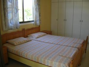 Postel nebo postele na pokoji v ubytování Marios Apartments