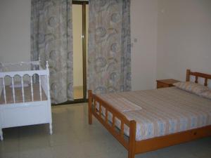 Postel nebo postele na pokoji v ubytování Marios Apartments