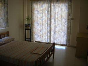 Postel nebo postele na pokoji v ubytování Marios Apartments