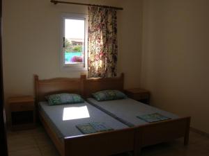 Postel nebo postele na pokoji v ubytování Marios Apartments