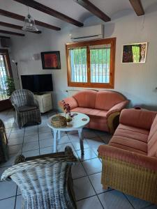 a living room with a couch and a table at Casa Vida Feliz in El Verger +32 photos