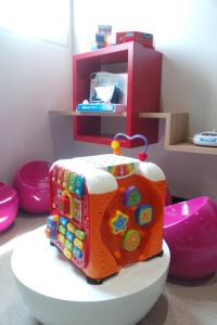 a cake sitting on top of a table in a kitchen at ibis Styles Deauville Centre in Deauville