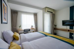 Ένα ή περισσότερα κρεβάτια σε δωμάτιο στο Hotel Dhika Serenity @ Jatiwarna +30 φωτογραφίες