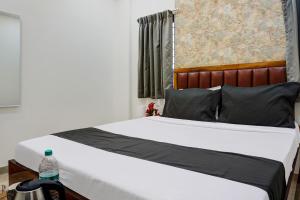 Postel nebo postele na pokoji v ubytování Hotel O KP Pride