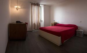 Postel nebo postele na pokoji v ubytování Residenza La Corte Assisi
