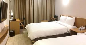 TV a/nebo společenská místnost v ubytování Mstay Hotel