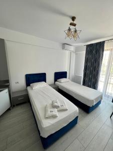 Postel nebo postele na pokoji v ubytování Luxury by SARAY