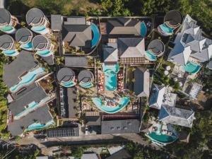 an overhead view of a resort with pools andazaz at Seascape Resort & Spa Uluwatu by Ini Vie Hospitality in Uluwatu