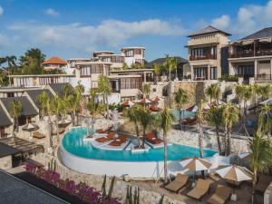 an aerial view of a resort with a swimming pool at Seascape Resort & Spa Uluwatu by Ini Vie Hospitality in Uluwatu +216 photos