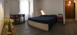 Postel nebo postele na pokoji v ubytování Residenza La Corte Assisi