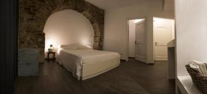 Postel nebo postele na pokoji v ubytování Residenza La Corte Assisi