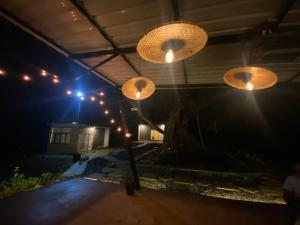 a group of lights in a garage at night at Calm Ville in Ponnampet +11 photos