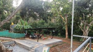 a park with a playground with a swing at Calm Ville in Ponnampet