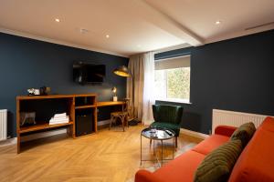 a living room with a couch and a table at Rob Roy - Self Check-In Boutique Accommodation in Berwick-Upon-Tweed