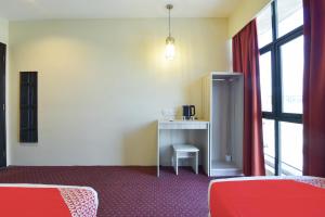 Η κουζίνα ή μικρή κουζίνα στο Hotel O Cozy Fox Hotel