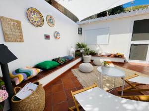 a living room with a couch and a table at Villa Anna in Messina