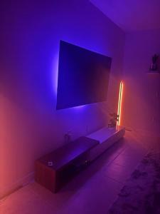 a living room with a couch and a tv at Modern Lux 3BR Home Near Disney and Lego Land! in Haines City