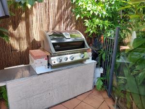 a toaster oven sitting on top of a table at Beauty tiny Walk To Sea in Port Douglas