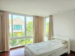 a bedroom with a bed and a large window at LELAWADEE Villa Cha -Am  +57 photos