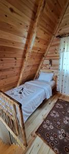 Ένα ή περισσότερα κρεβάτια σε δωμάτιο στο Eco Village Podgora