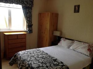 Postel nebo postele na pokoji v ubytování Divine Mercy B&B