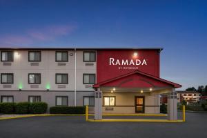 a building with a sign that reads rambadi on it at Ramada by Wyndham York Harrisburg Hershey in York