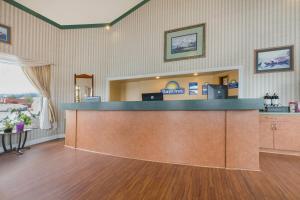 an empty waiting room with a cash counter in a hospital at Days Inn by Wyndham Auburn in Auburn