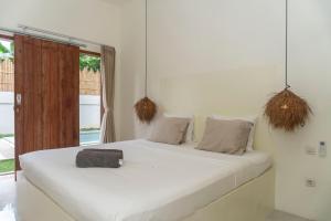 Una cama o camas en una habitación de Nuralya Villa 3 Bedroom with Private pool