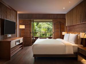 Hyatt Regency Bali客房内的一张或多张床位